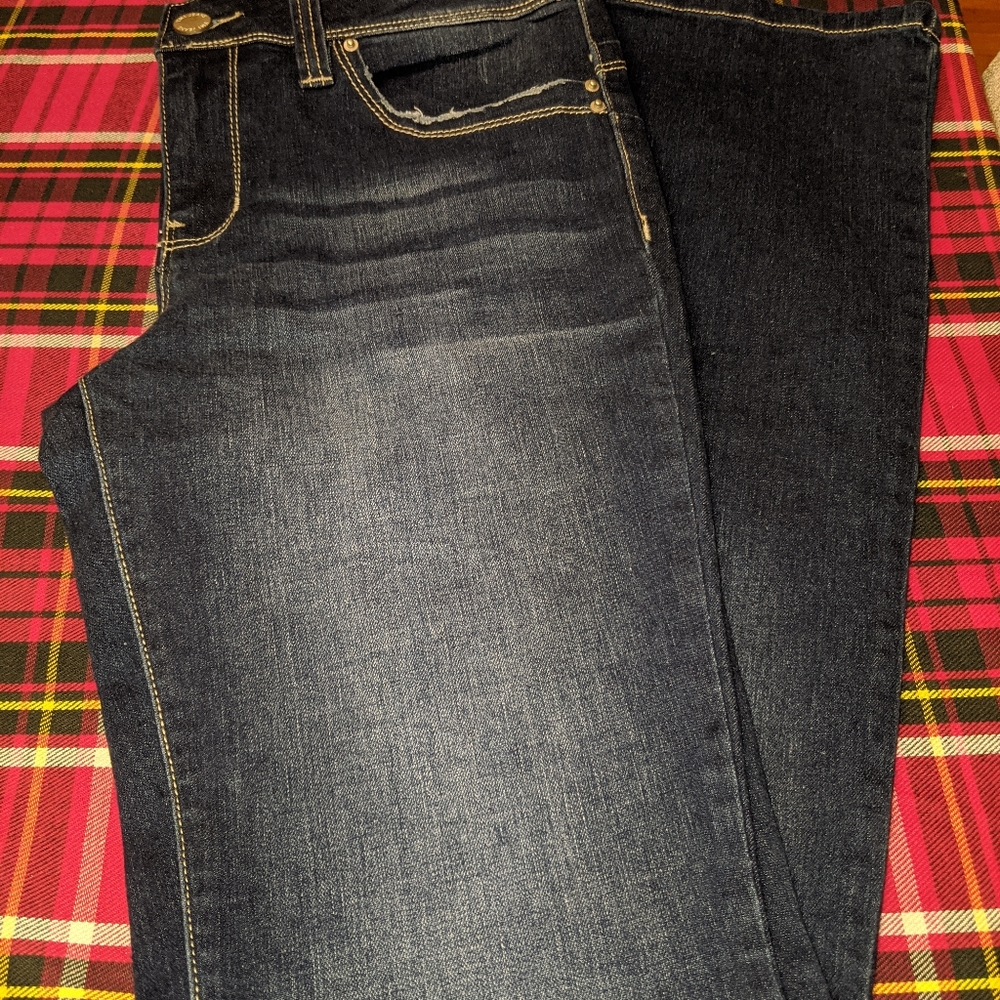 Distressed wide leg mid rise jean
